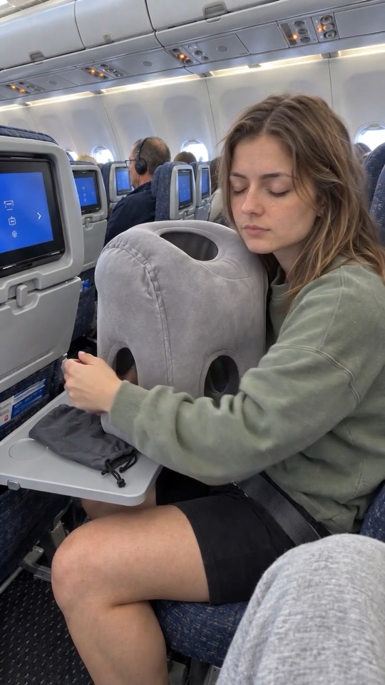 Arms through the pillow, head down